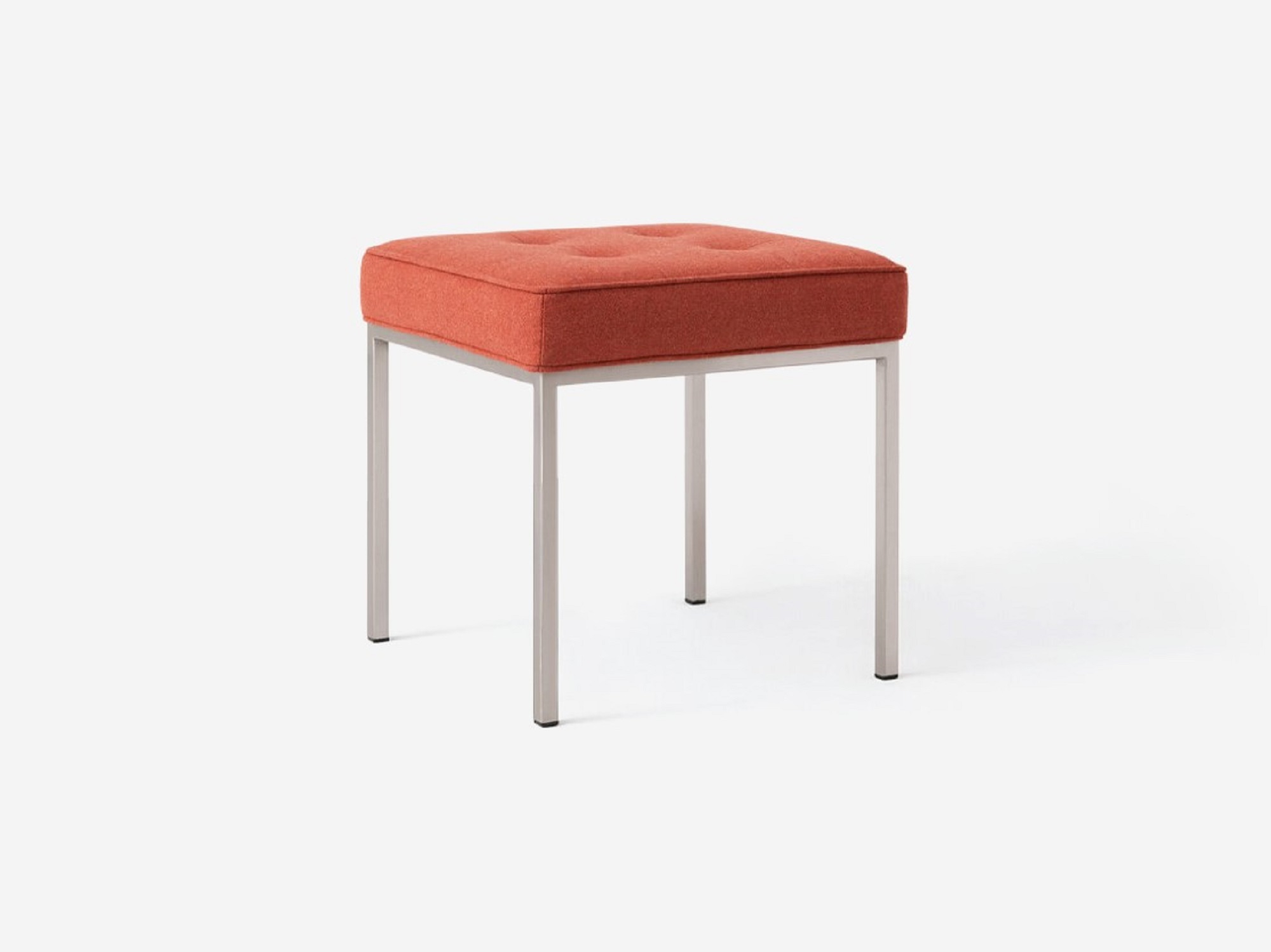 Angled view of the Bank fabric stool with red seat and stainless steel base